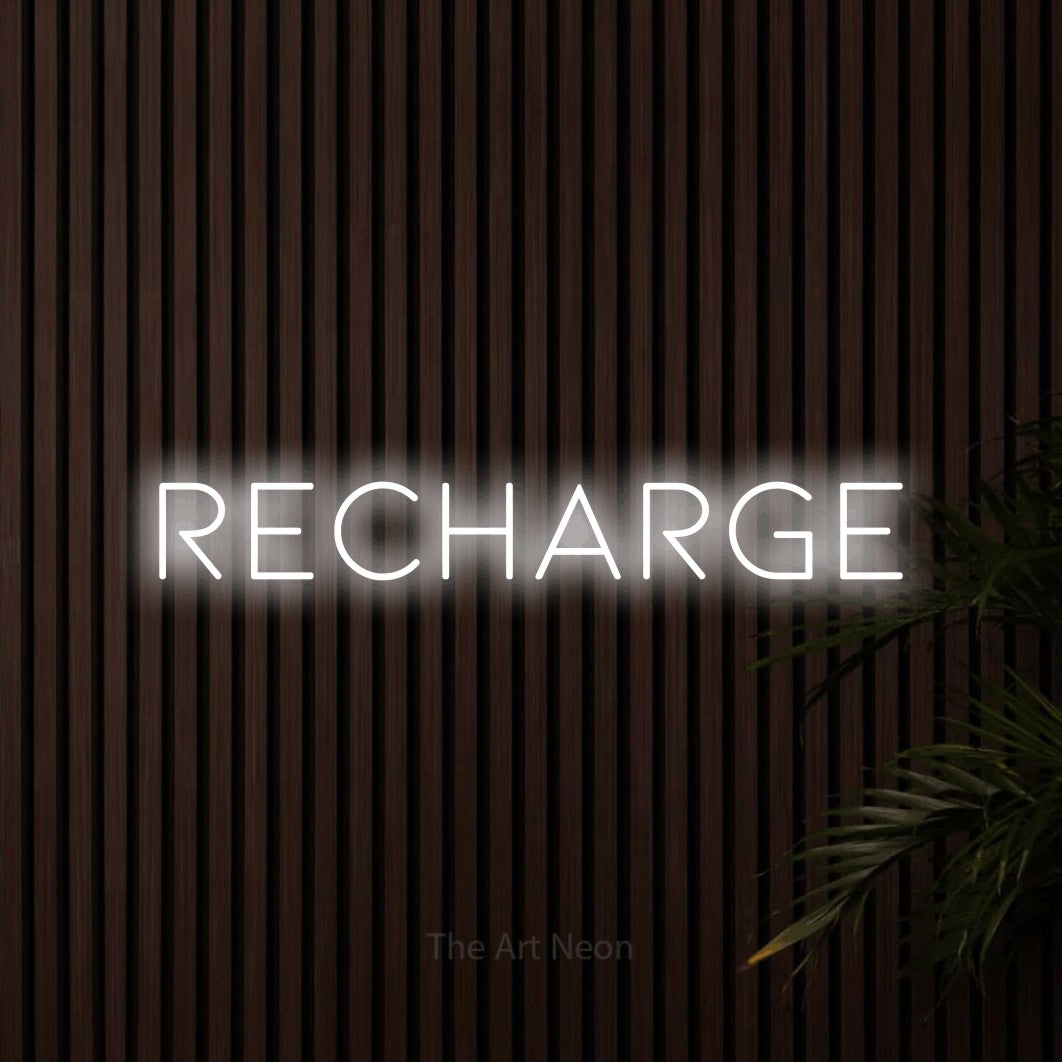 Cool white LED neon sign reading "Recharge" against dark wooden slats for bedroom décor