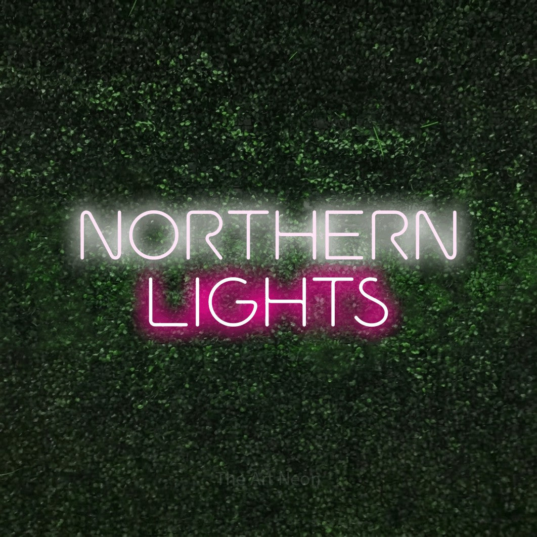 Hot pink and cool white LED neon sign reading "Northern Lights" against a textured green moss wall for bedroom décor