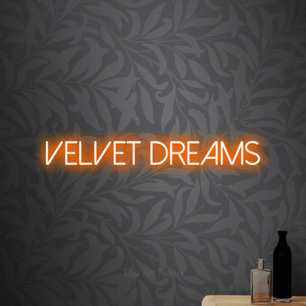 Orange LED neon sign reading "Velvet Dreams" against light grey floral wallpaper for bedroom décor