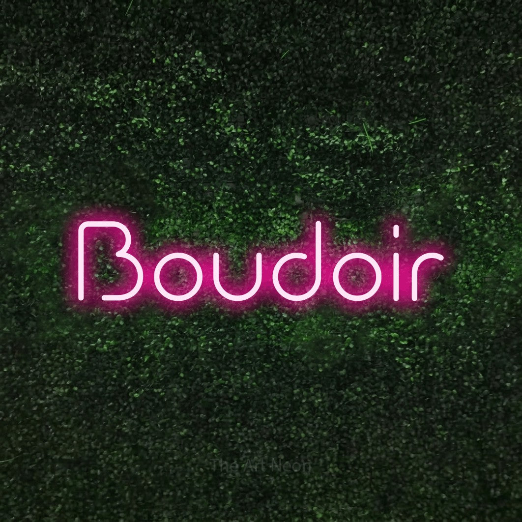 Hot pink LED neon sign reading "Boudoir" against a textured green moss wall for bedroom décor