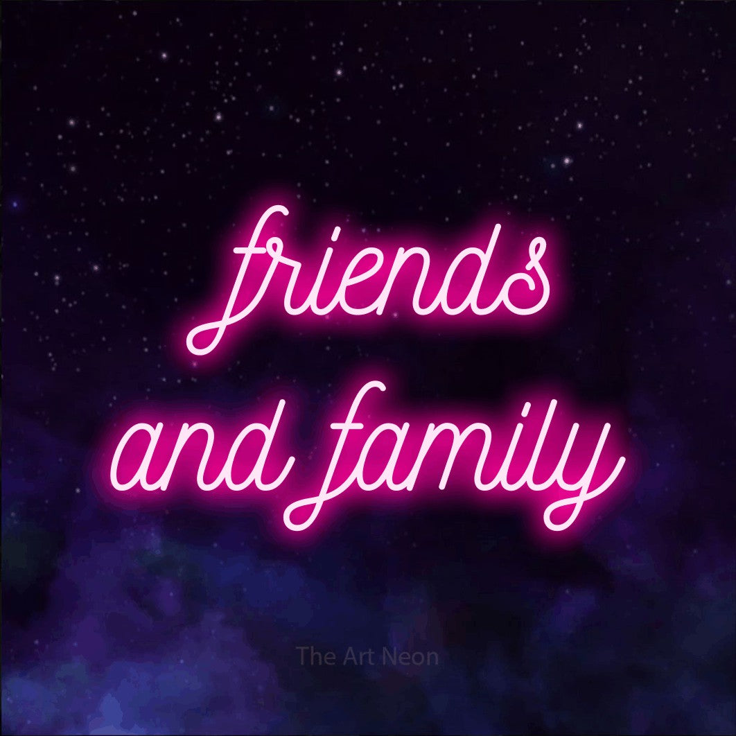 Hot pink script-style LED neon sign reading "Friends and Family" against a purple galaxy background for living room décor