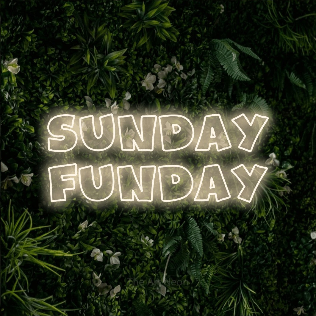 Warm white outline-style LED neon sign reading "Sunday Funday" against a leafy green wall for living room décor