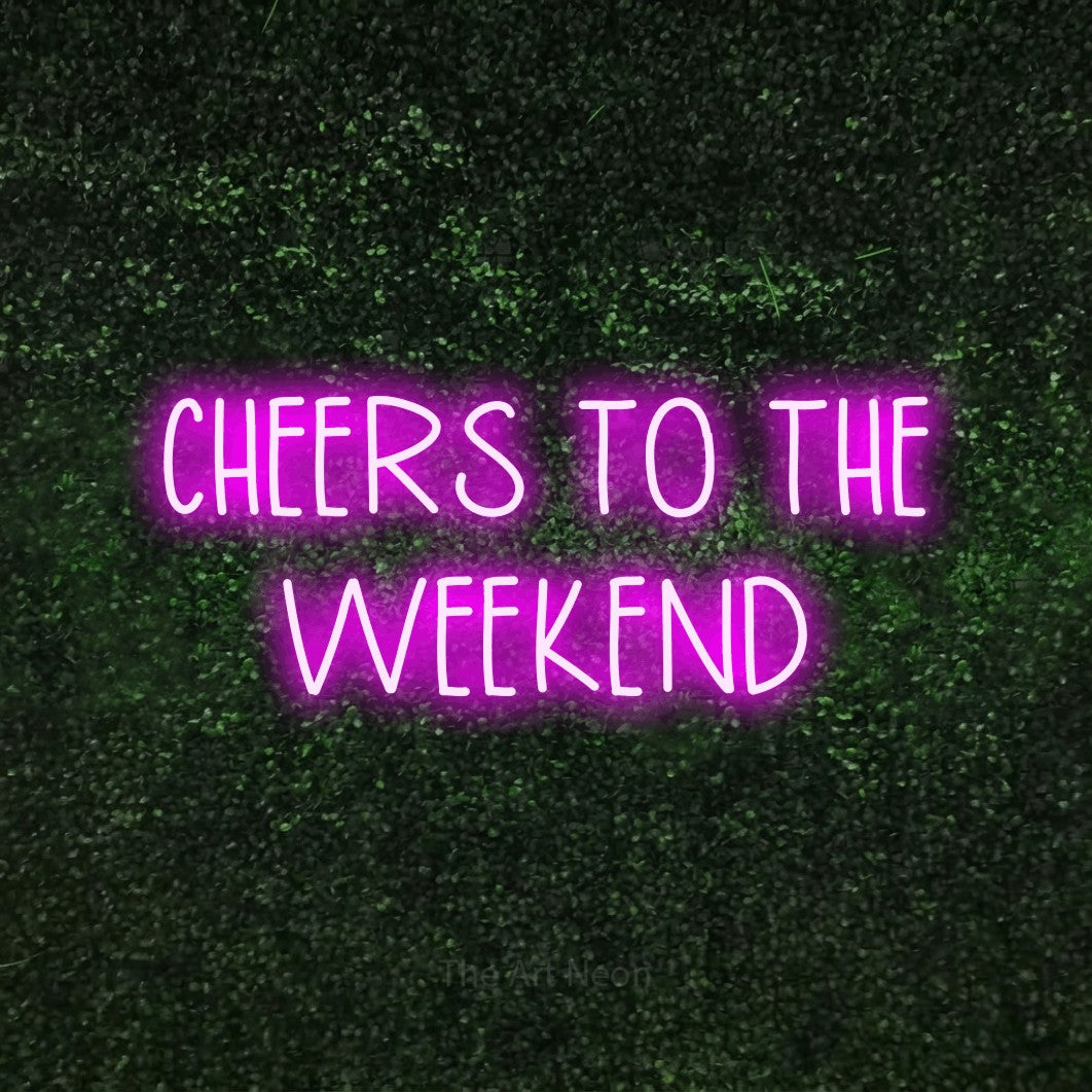 Pink LED neon sign reading "Cheers to the Weekend" against a textured green moss wall for living room décor