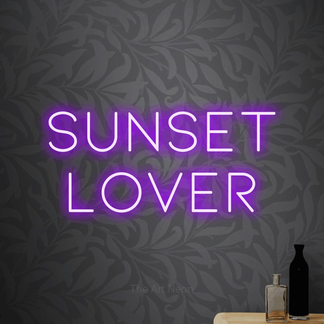 Purple LED neon sign reading "Sunset Lover" against light grey floral wallpaper for living room décor