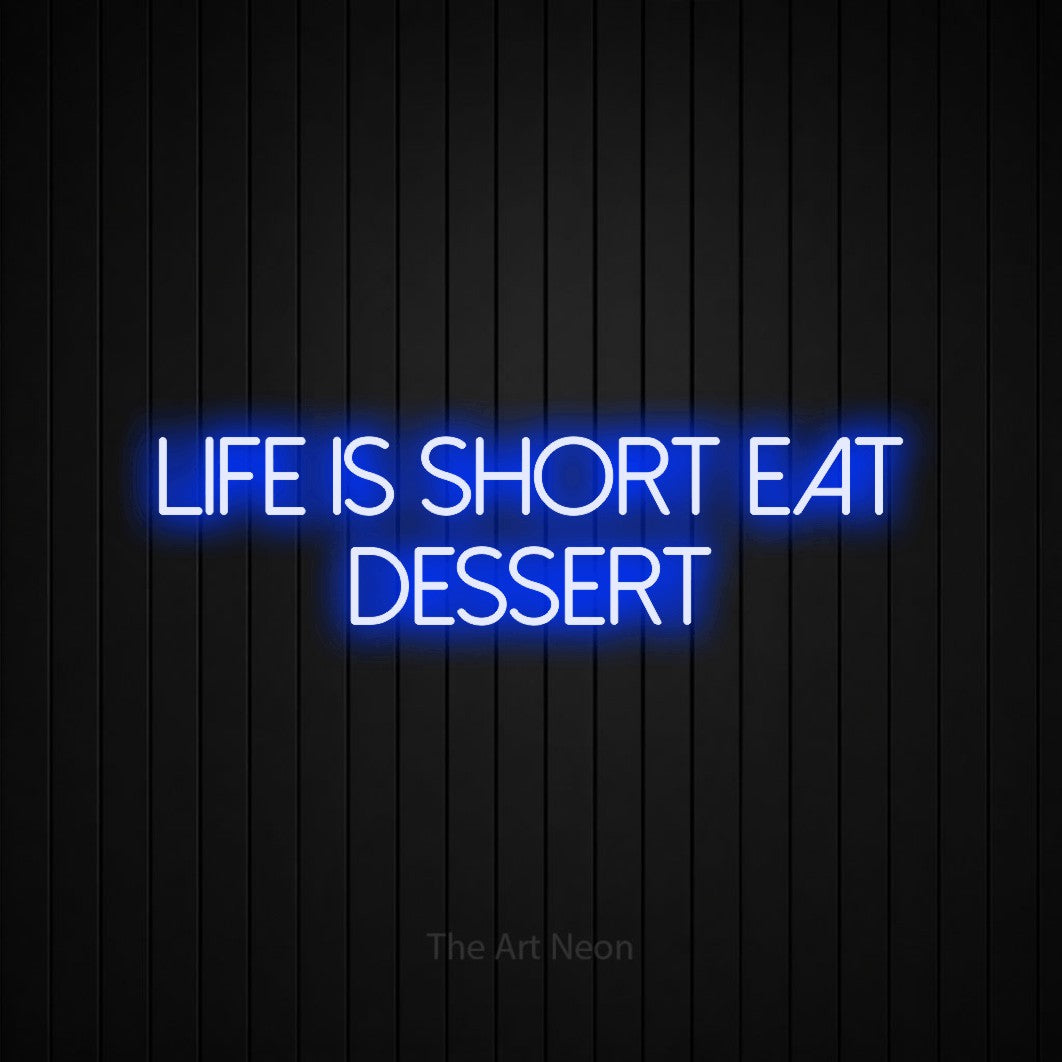 Blue LED neon sign reading "Life is Short Eat Dessert" against a black vertical slat wall for kitchen décor