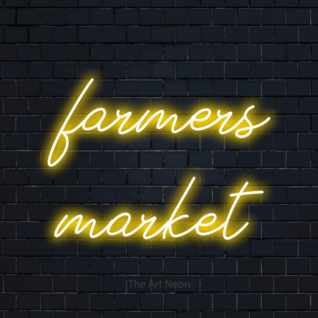 Yellow script-style LED neon sign reading "Farmers Market" against a dark navy brick wall for kitchen décor