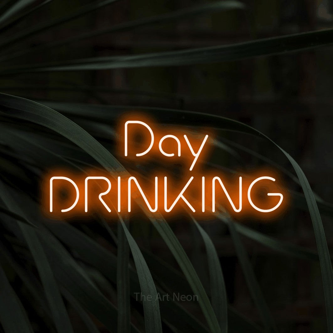 Orange LED neon sign reading "Day Drinking" against dark tropical leaves for bar décor