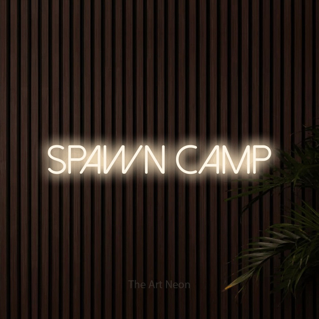 Warm white LED neon sign reading "Spawn Camp" against dark wooden slats for gaming room décor