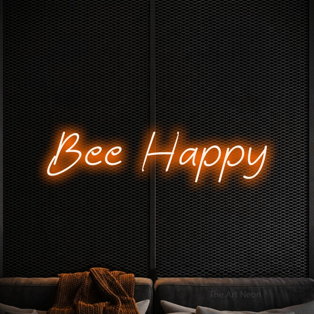 Orange LED neon sign reading "Bee Happy" against a black textured wall