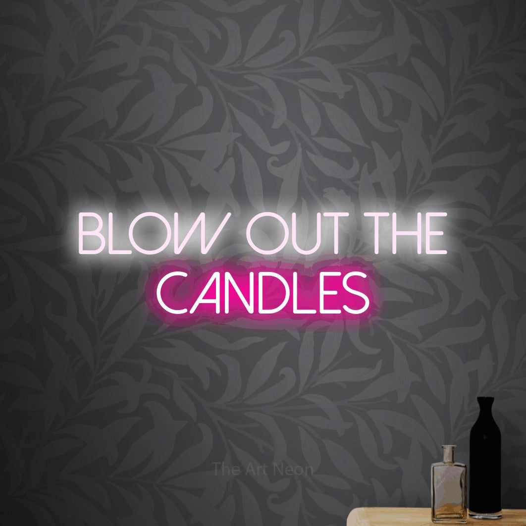 Hot pink and cool white LED neon sign reading "Blow Out the Candles" against light grey floral wallpaper for party décor