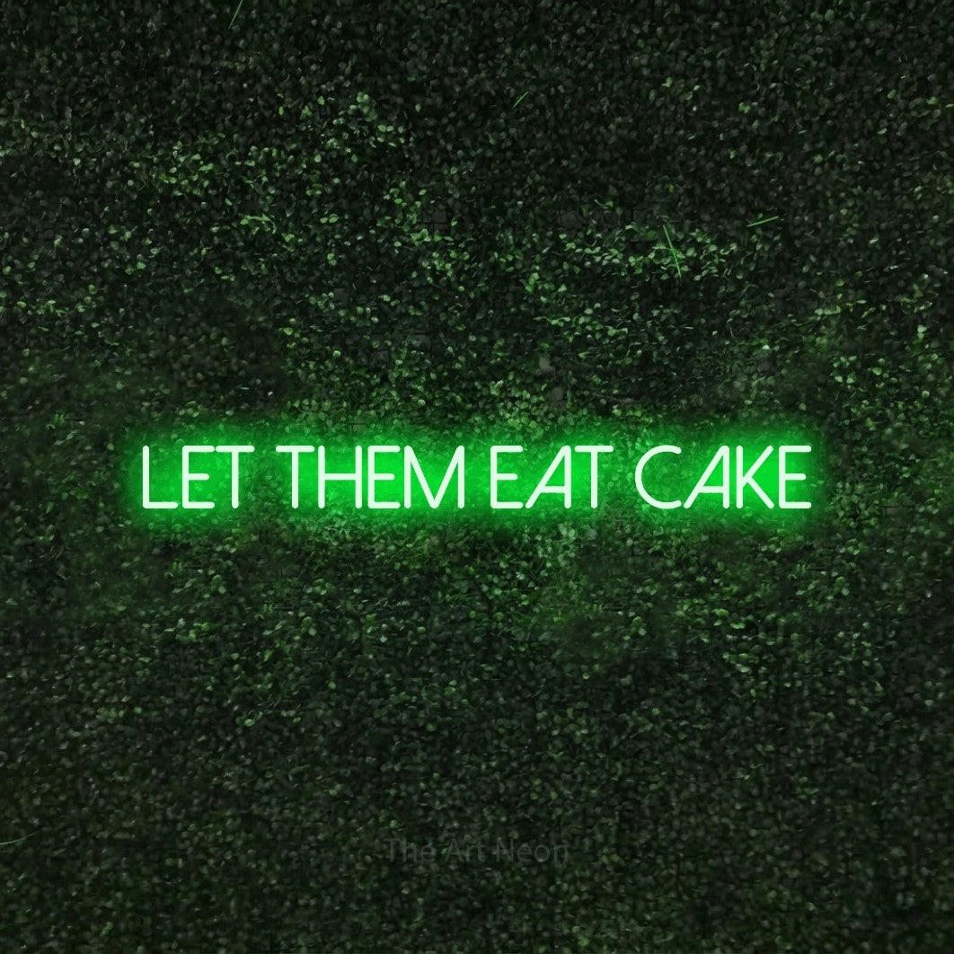 Green LED neon sign reading "Let Them Eat Cake" against a textured green moss wall for party décor