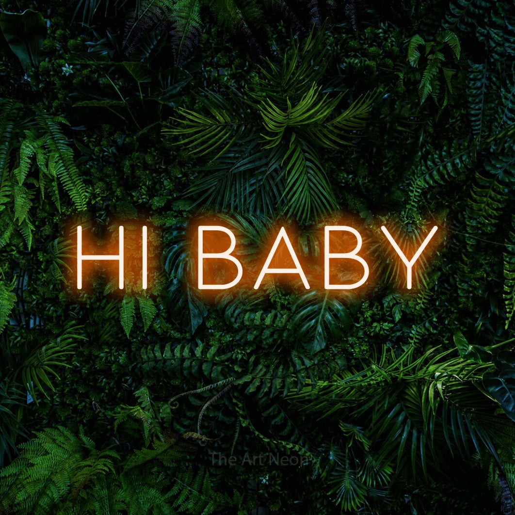 Orange LED neon sign reading "Hi Baby" against a dense tropical foliage wall