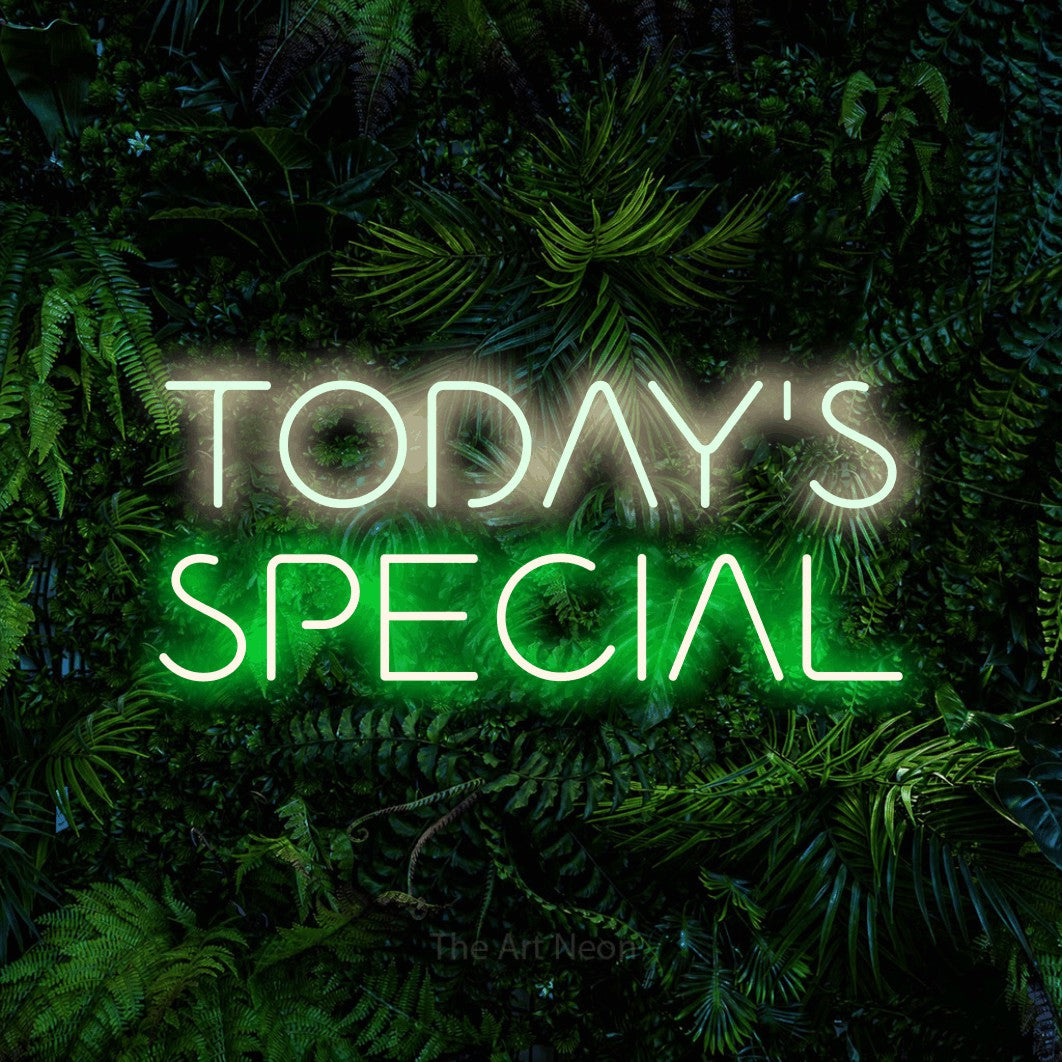 Green and warm white LED neon sign reading "Today's Special" against a dense tropical foliage wall for restaurant décor