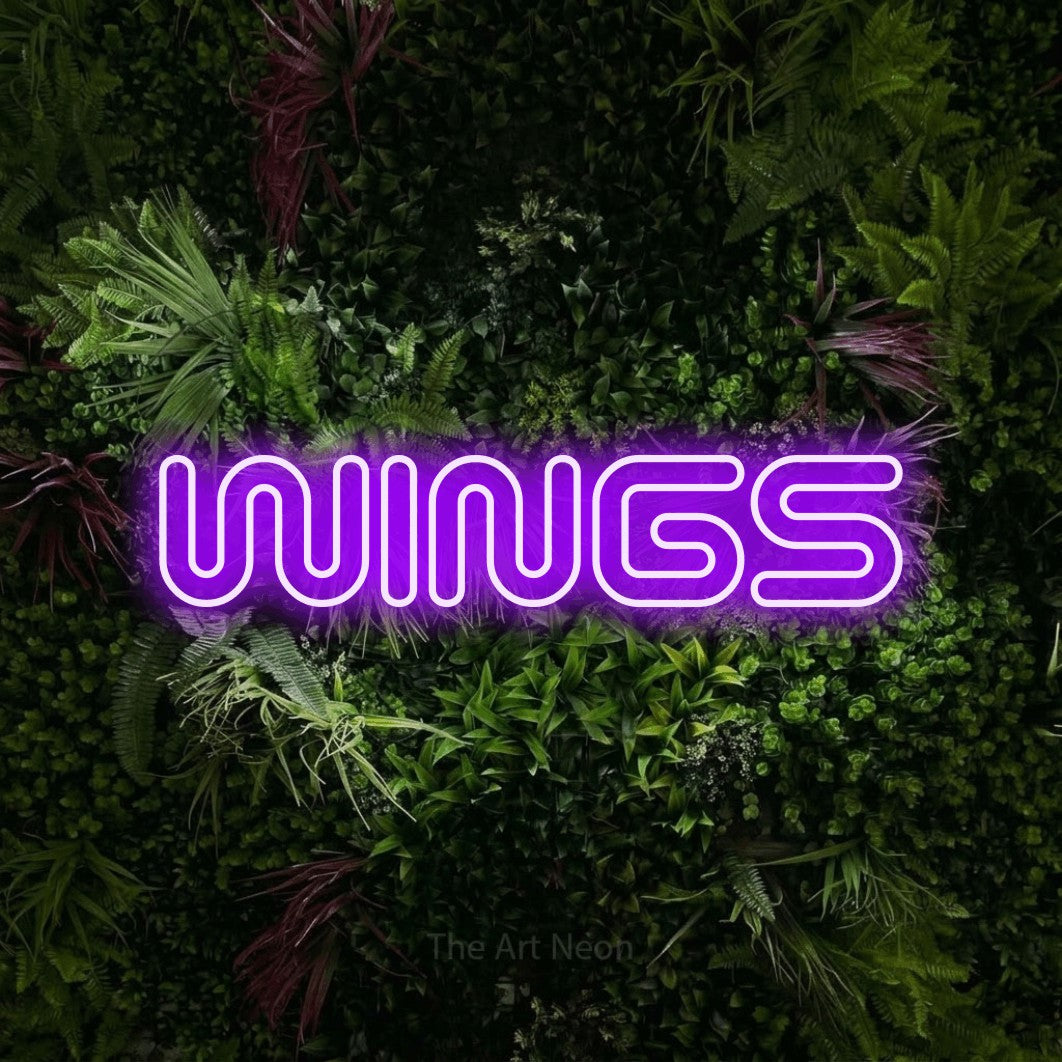 Purple outline-style LED neon sign reading "Wings" against a lush garden wall with pink flowers for restaurant décor