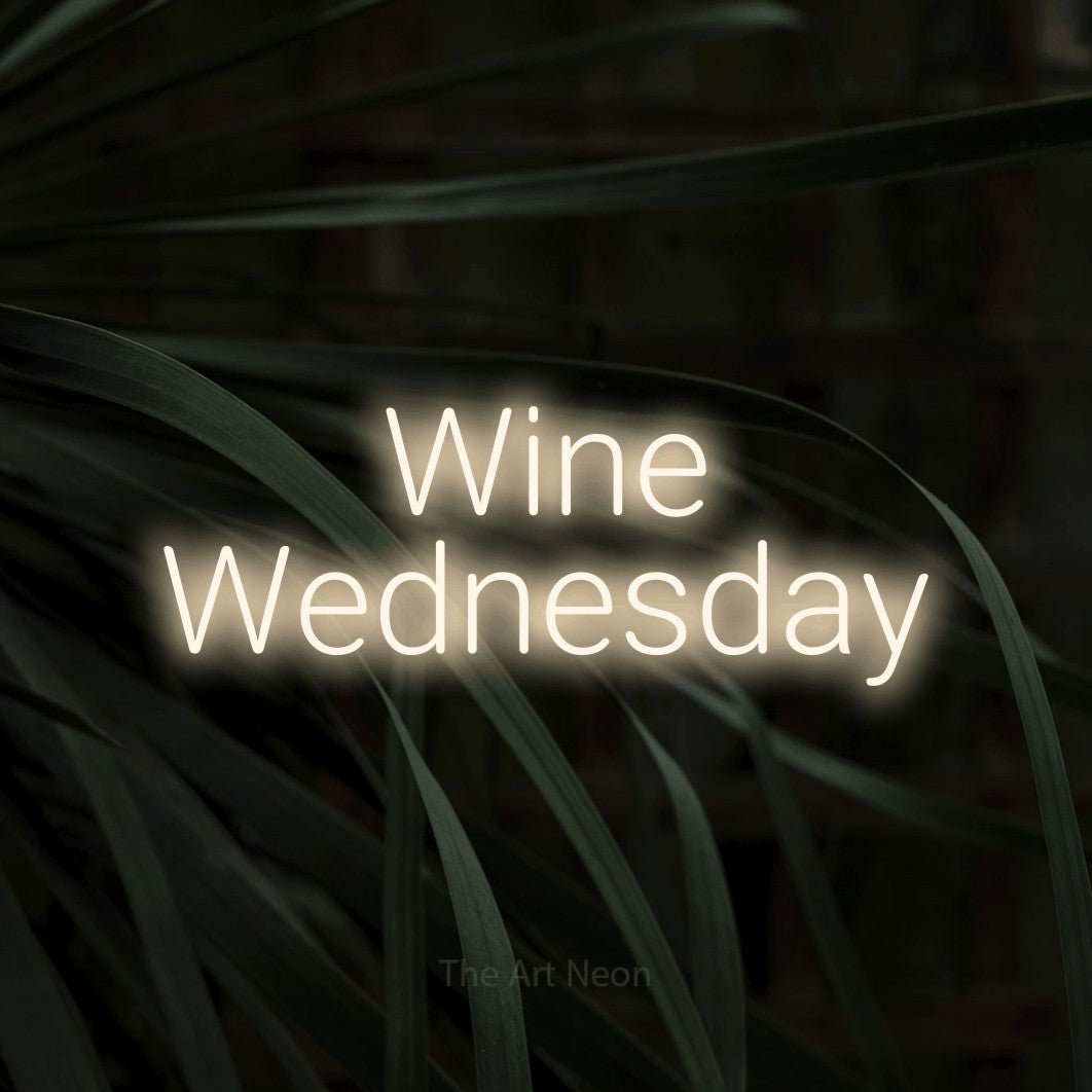 Warm white LED neon sign reading "Wine Wednesday" against dark tropical leaves for bar décor