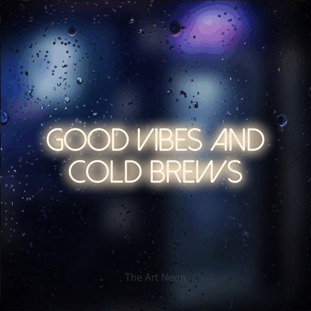 Warm white LED neon sign reading "Good Vibes and Cold Brews" against a dark blue bokeh background for bar décor
