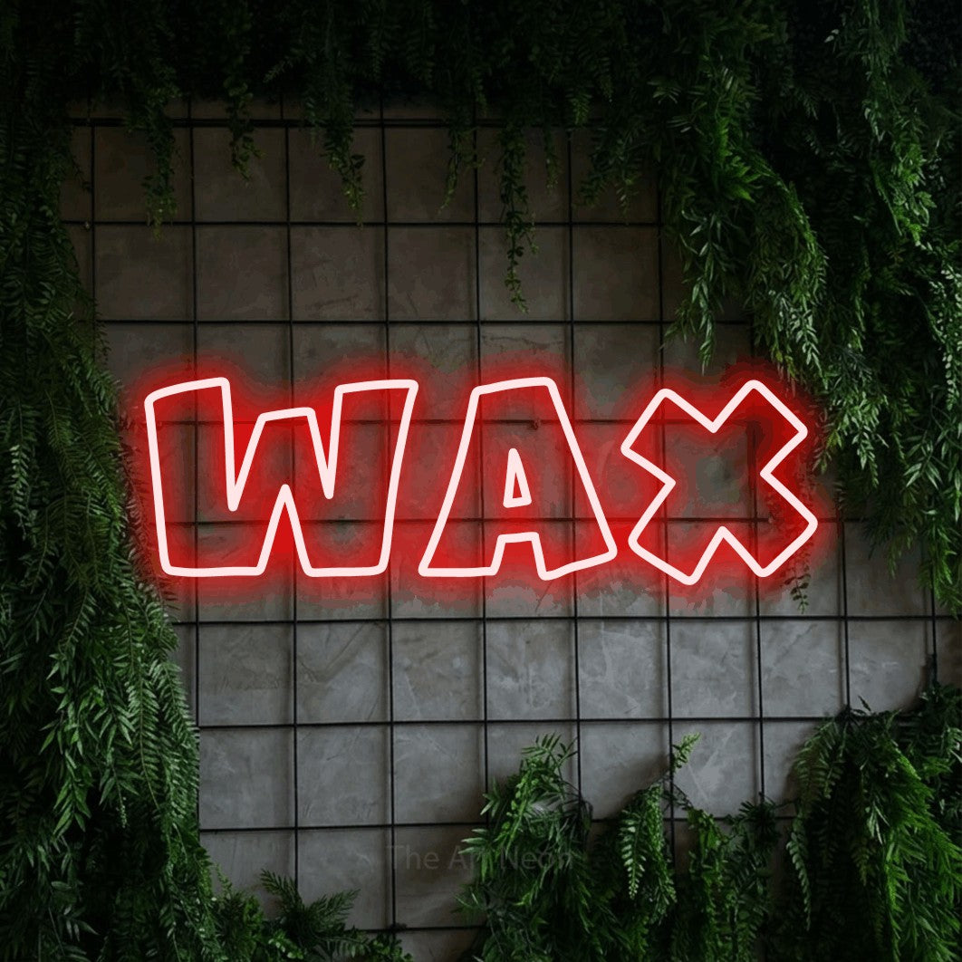 Red outline-style LED neon sign reading "Wax" against a green grid wall with foliage for salon décor
