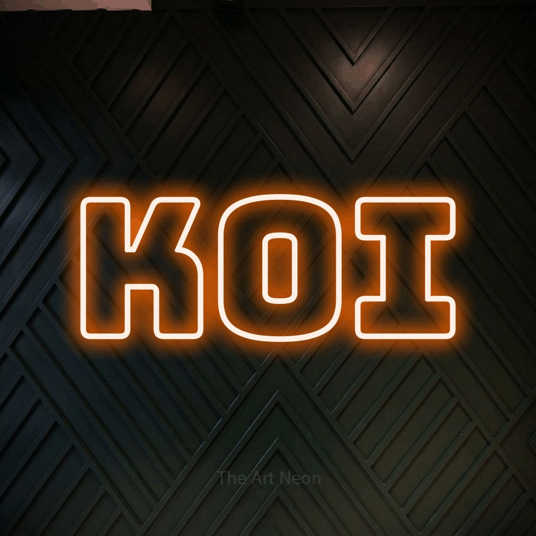 Orange outline-style LED neon sign reading "Koi" against a dark geometric wood wall for tattoo studio décor