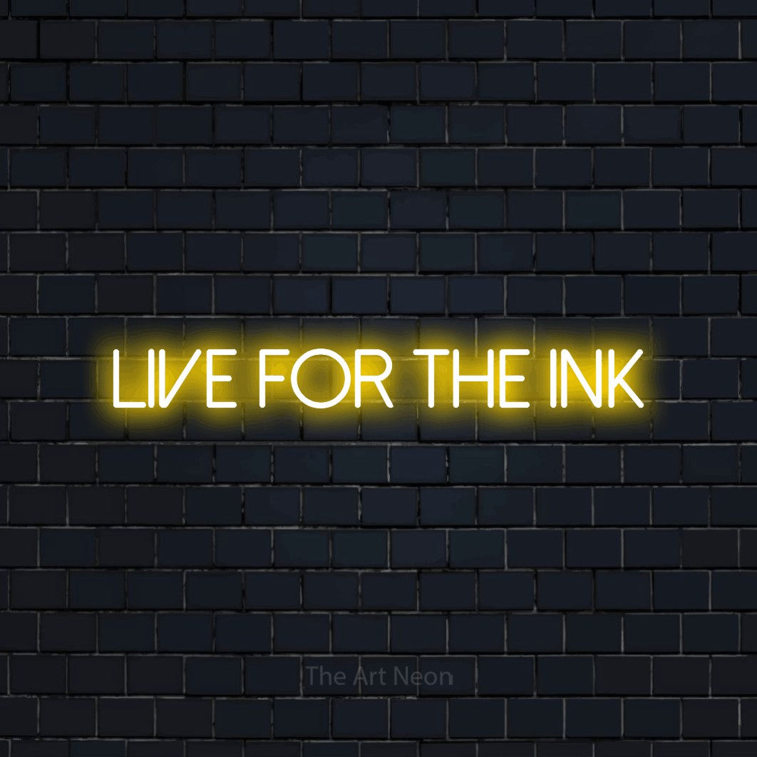 Yellow LED neon sign reading "Live for the Ink" against a dark navy brick wall for tattoo studio décor
