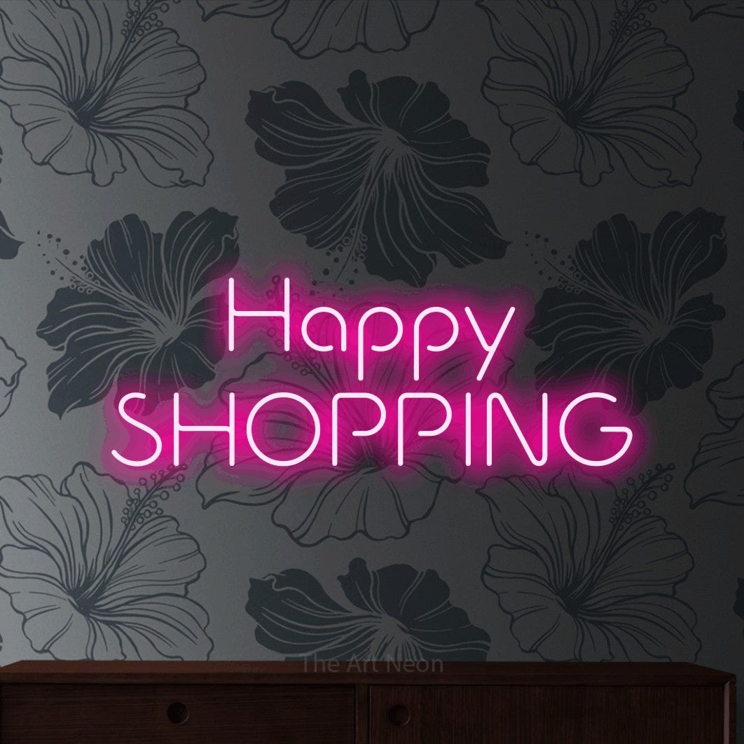 Hot pink LED neon sign reading "Happy Shopping" against grey floral wallpaper