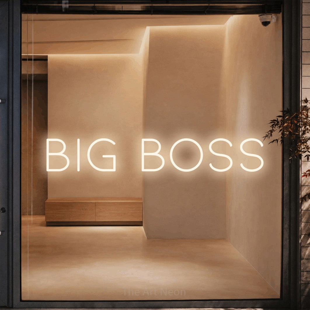 Warm white LED neon sign reading "Big Boss" against a warm beige alcove wall for office décor