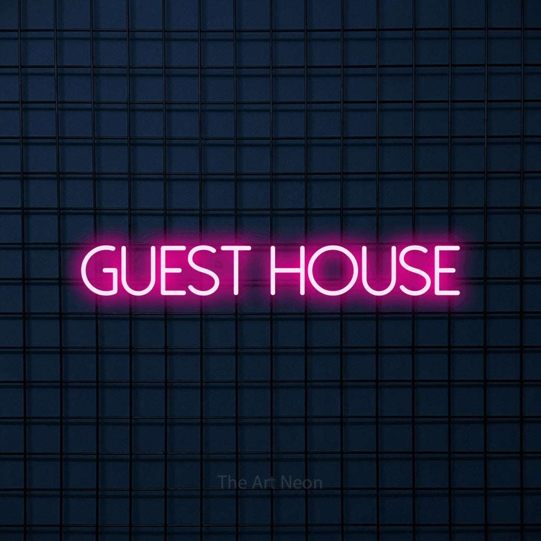 Hot pink LED neon sign reading "Guest House" against a dark blue tiled wall for hotel décor