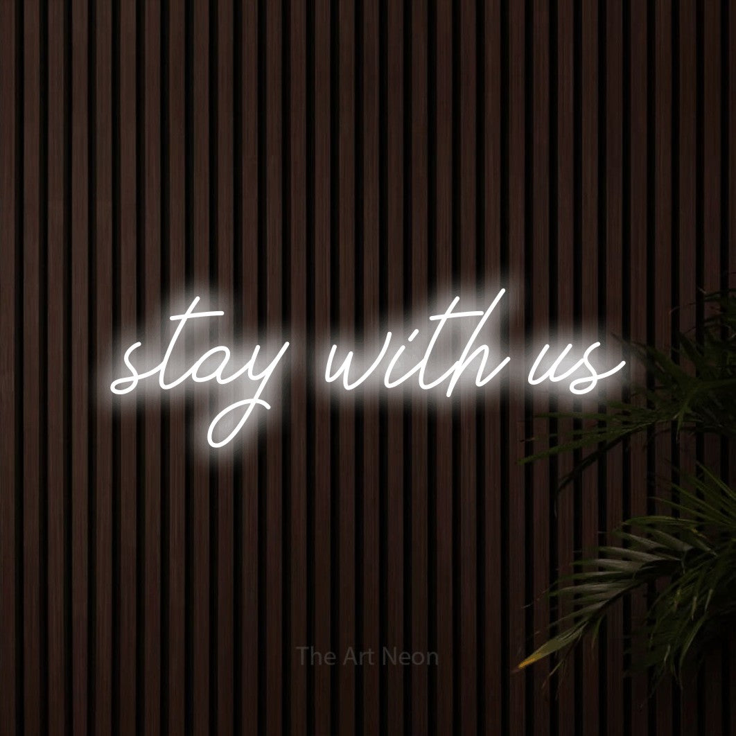 Cool white script-style LED neon sign reading "Stay with Us" against dark wooden slats for hotel décor