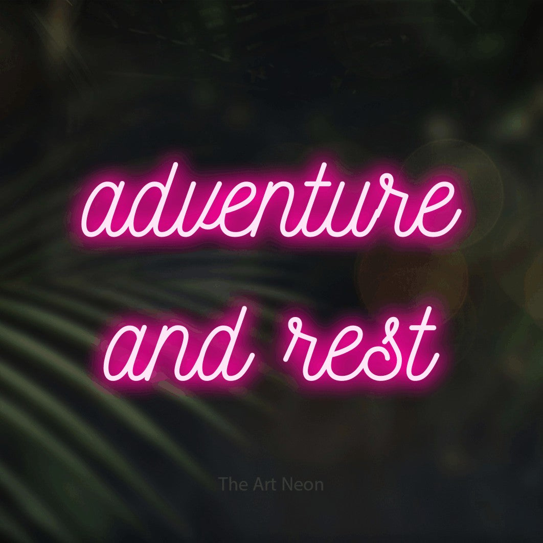 Hot pink script-style LED neon sign reading "Adventure and Rest" against dark blurred palm leaves for hotel décor