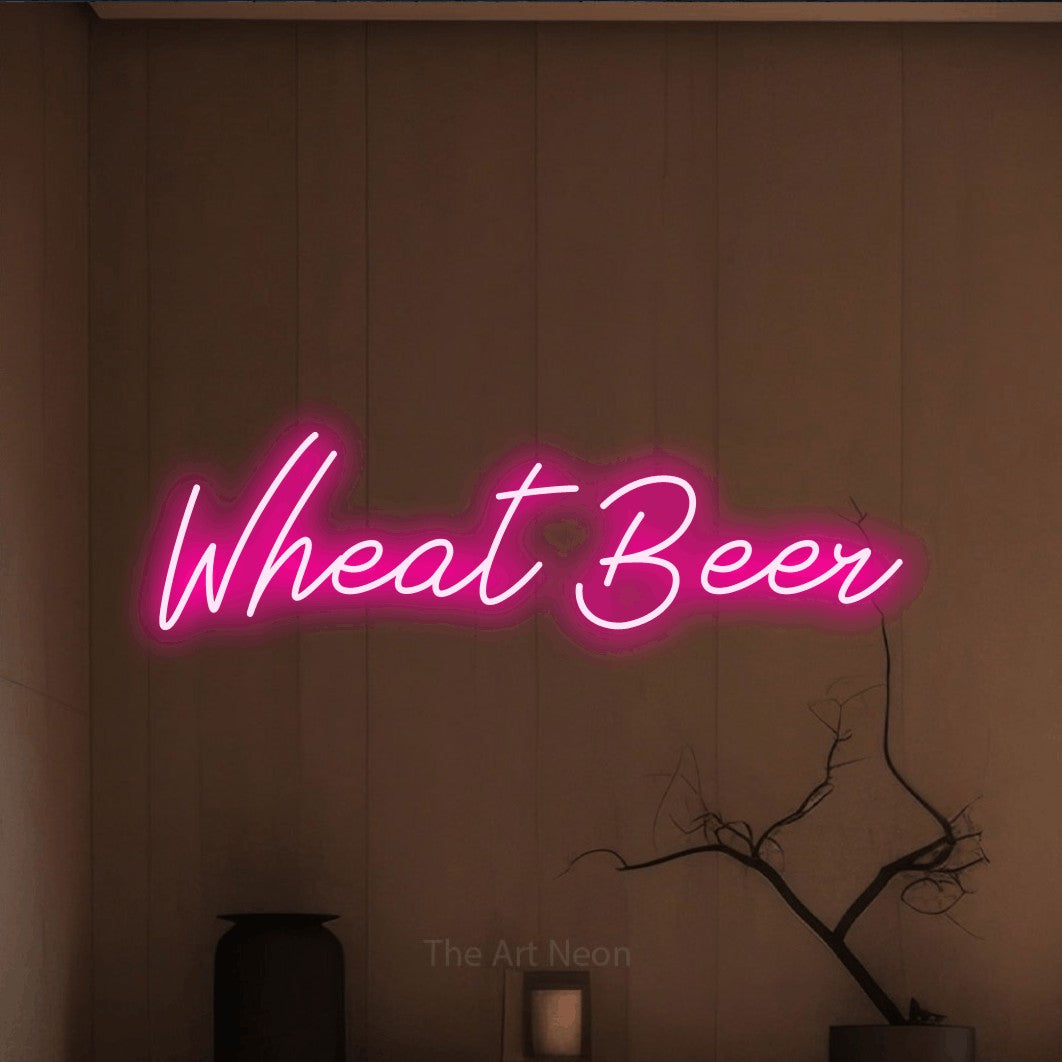 Hot pink script-style LED neon sign reading "Wheat Beer" against a warm brown wall
