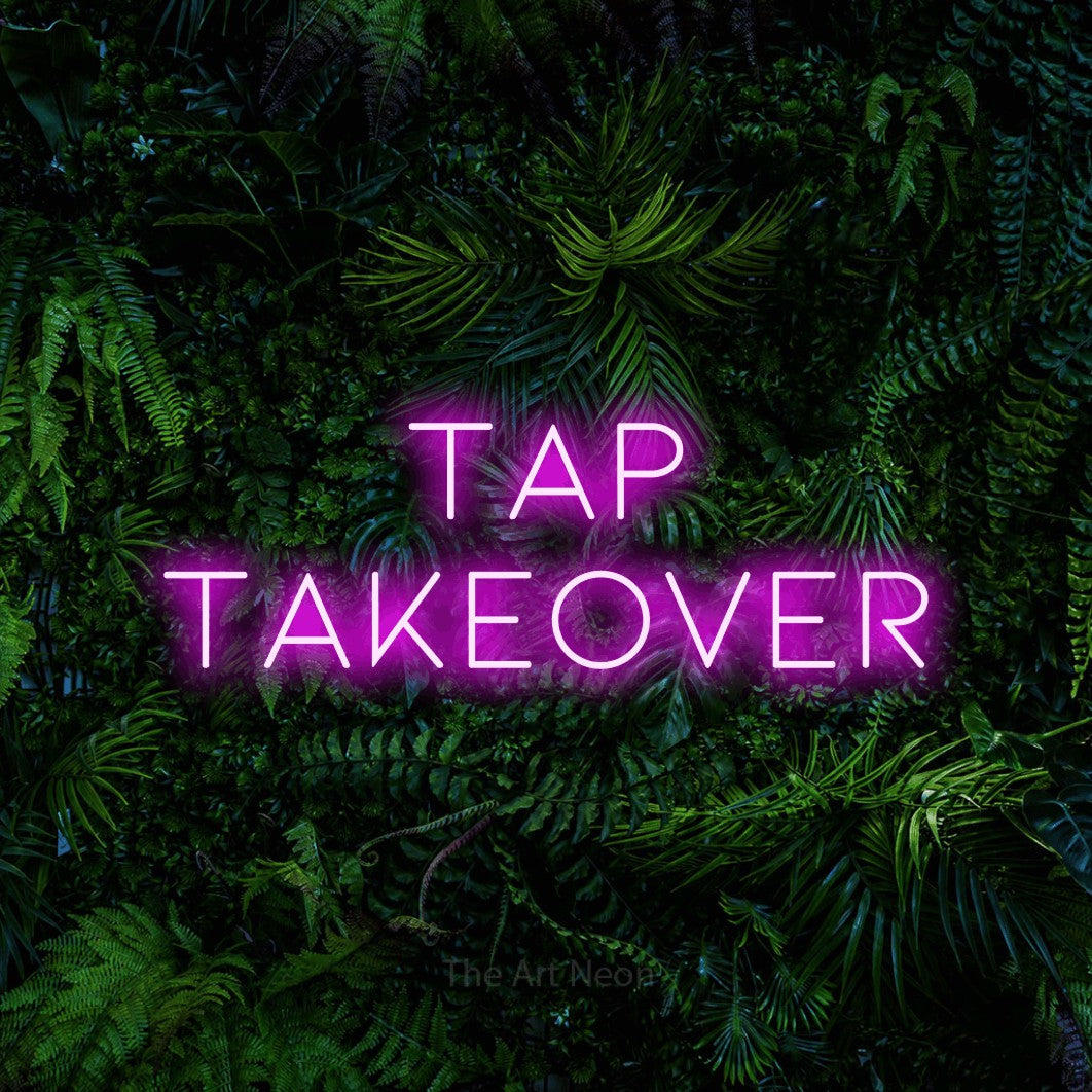 Pink LED neon sign reading "Tap Takeover" against a dense tropical foliage wall