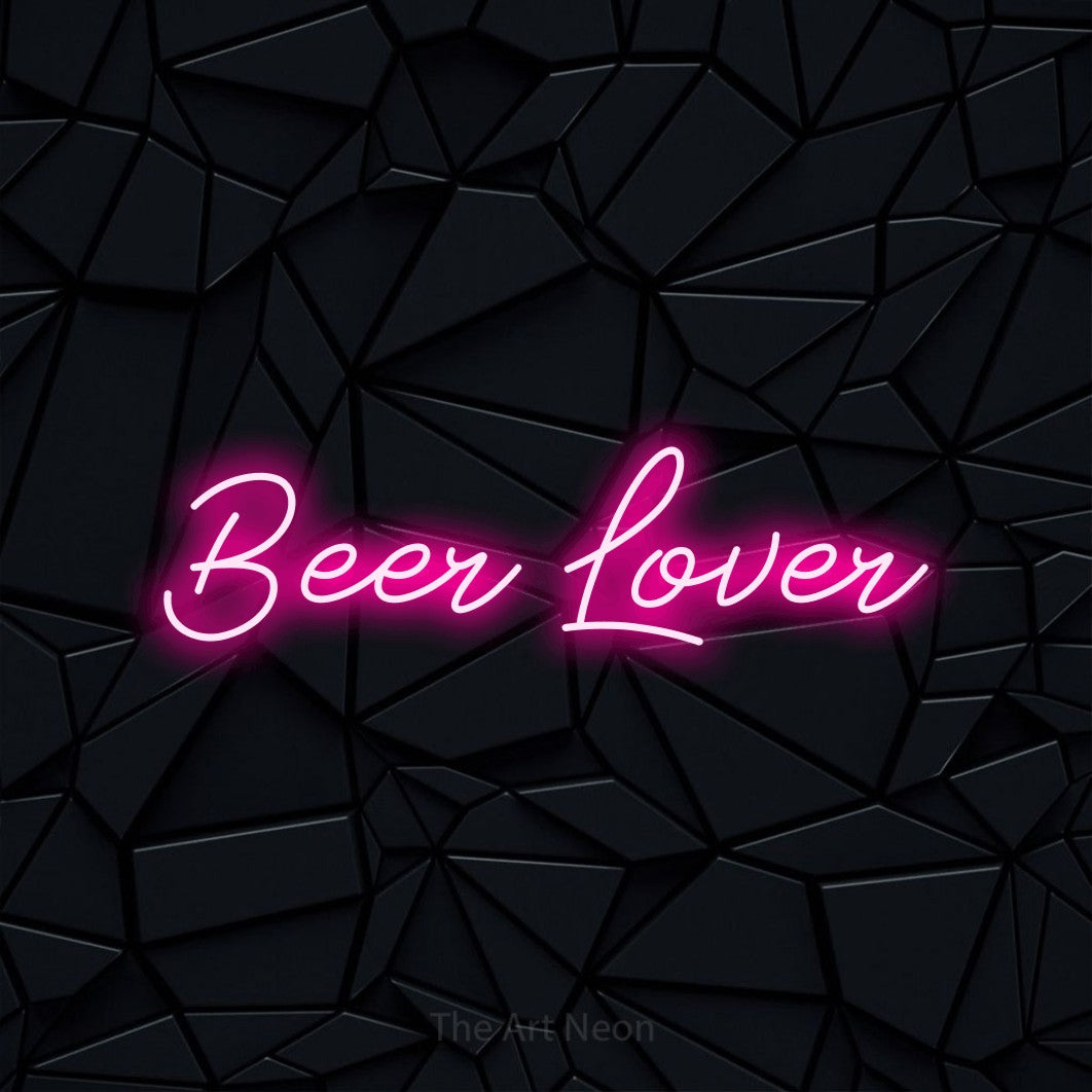 Hot pink script-style LED neon sign reading "Beer Lover" against a black faceted wall