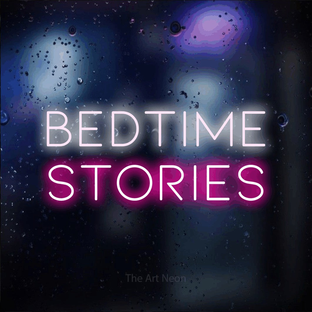 Hot pink and cool white LED neon sign reading "Bedtime Stories" against a dark blue bokeh background for bedroom décor
