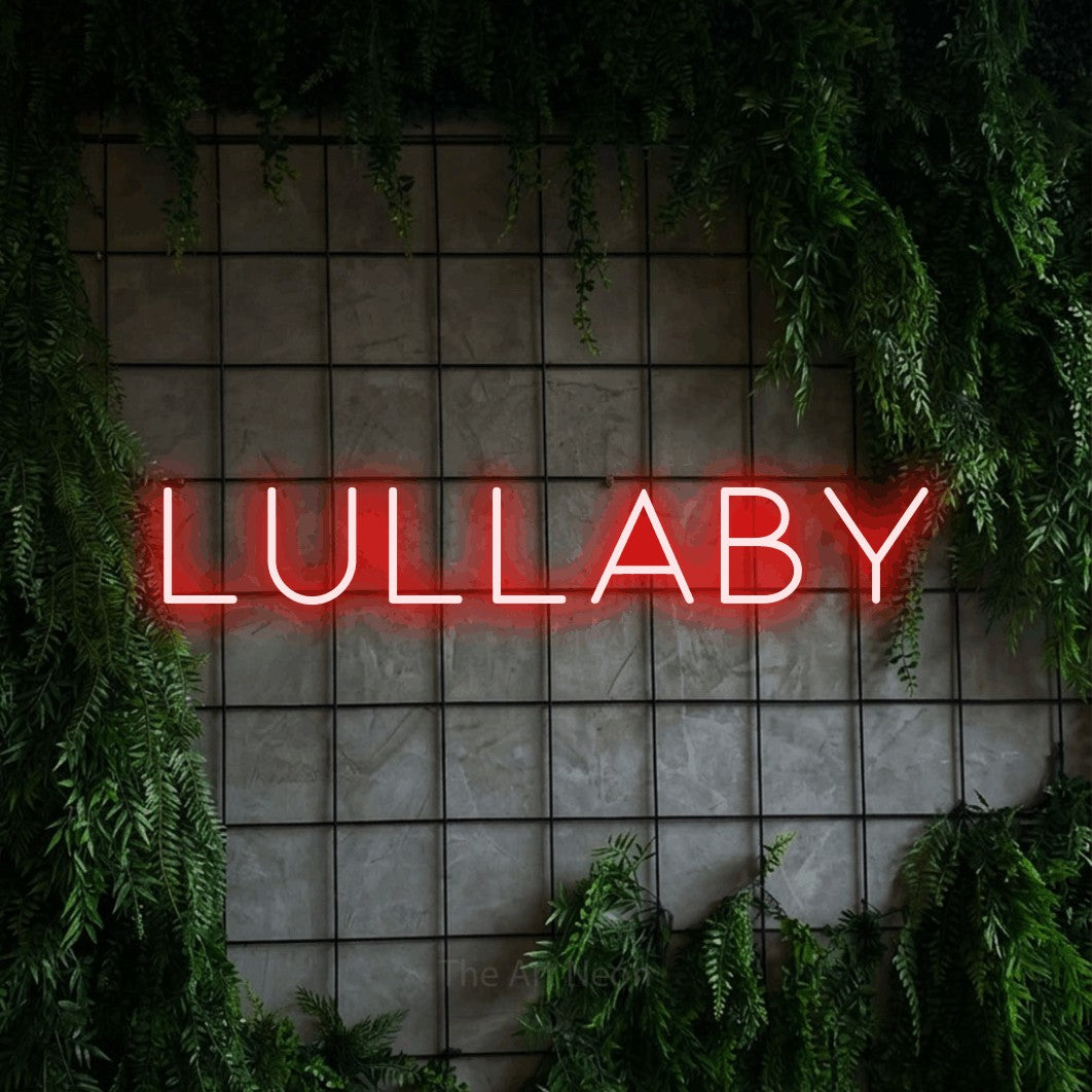 Red LED neon sign reading "Lullaby" against a green grid wall with foliage for bedroom décor