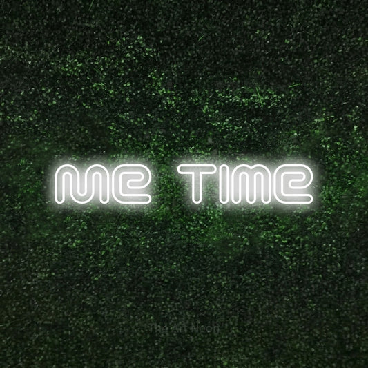 Cool white outline-style LED neon sign reading "Me Time" against a textured green moss wall for bedroom décor