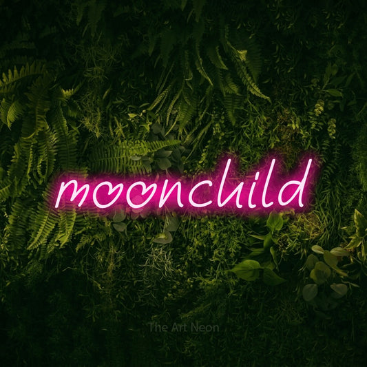 Hot pink LED neon sign reading "Moonchild" against a moss-covered green wall for bedroom décor
