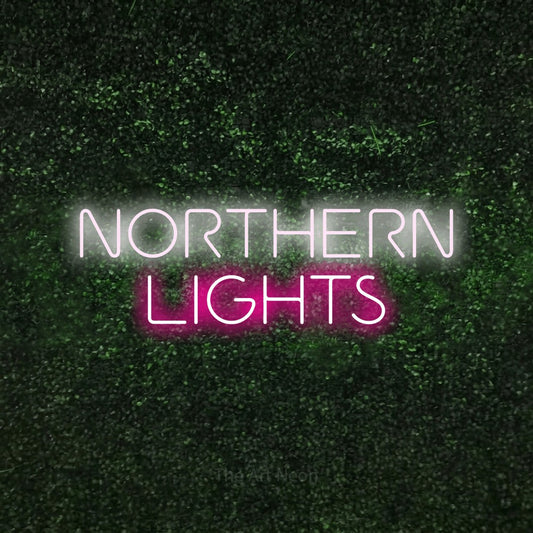 Hot pink and cool white LED neon sign reading "Northern Lights" against a textured green moss wall for bedroom décor