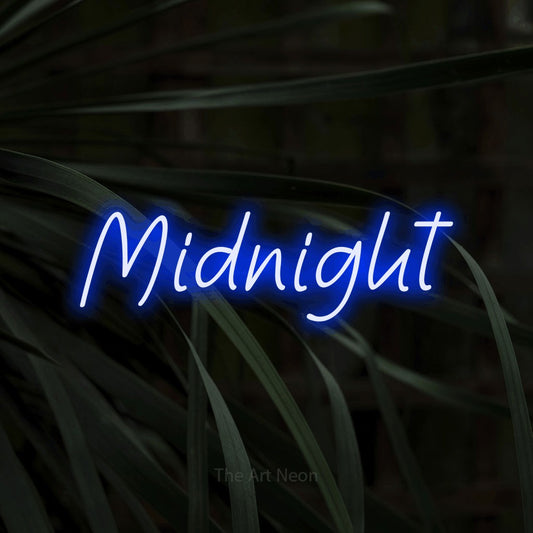 Blue LED neon sign reading "Midnight" against dark tropical leaves for bedroom décor