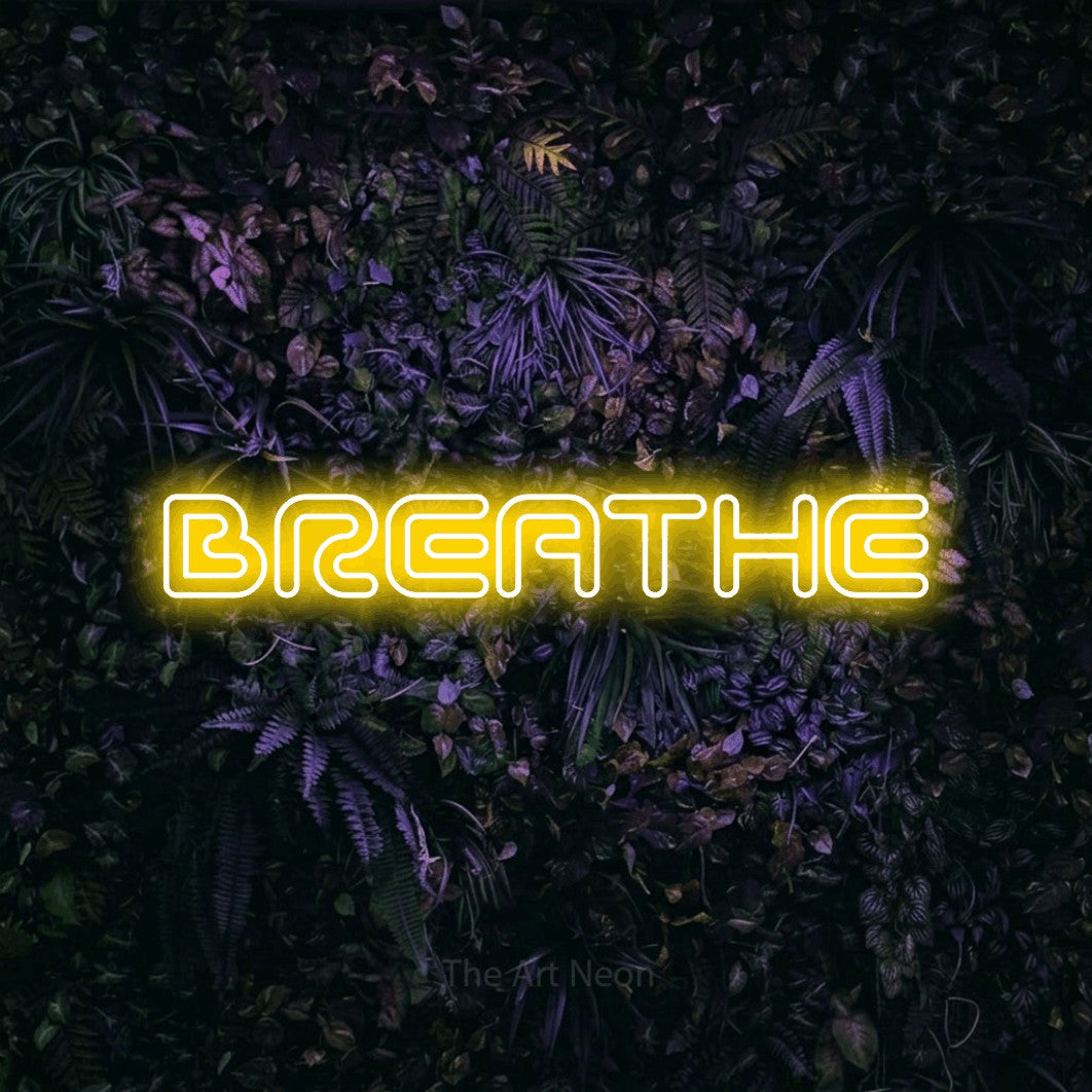 Yellow outline-style LED neon sign reading "Breathe" against a purple floral wall for bedroom décor