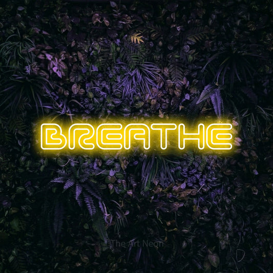 Yellow outline-style LED neon sign reading "Breathe" against a purple floral wall for bedroom décor