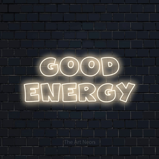 Warm white outline-style LED neon sign reading "Good Energy" against a dark navy brick wall for bedroom décor