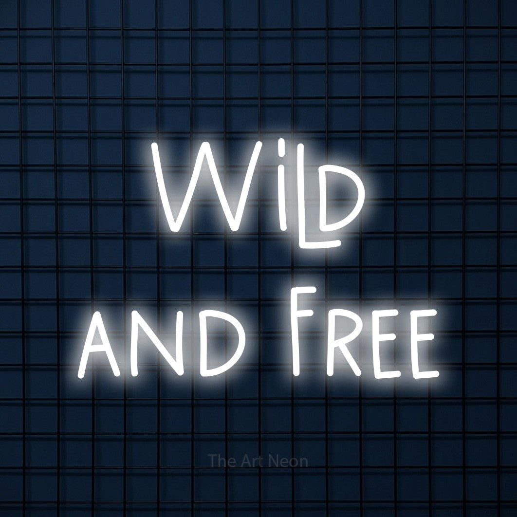 Cool white LED neon sign reading "Wild and Free" against a dark blue tiled wall for bedroom décor