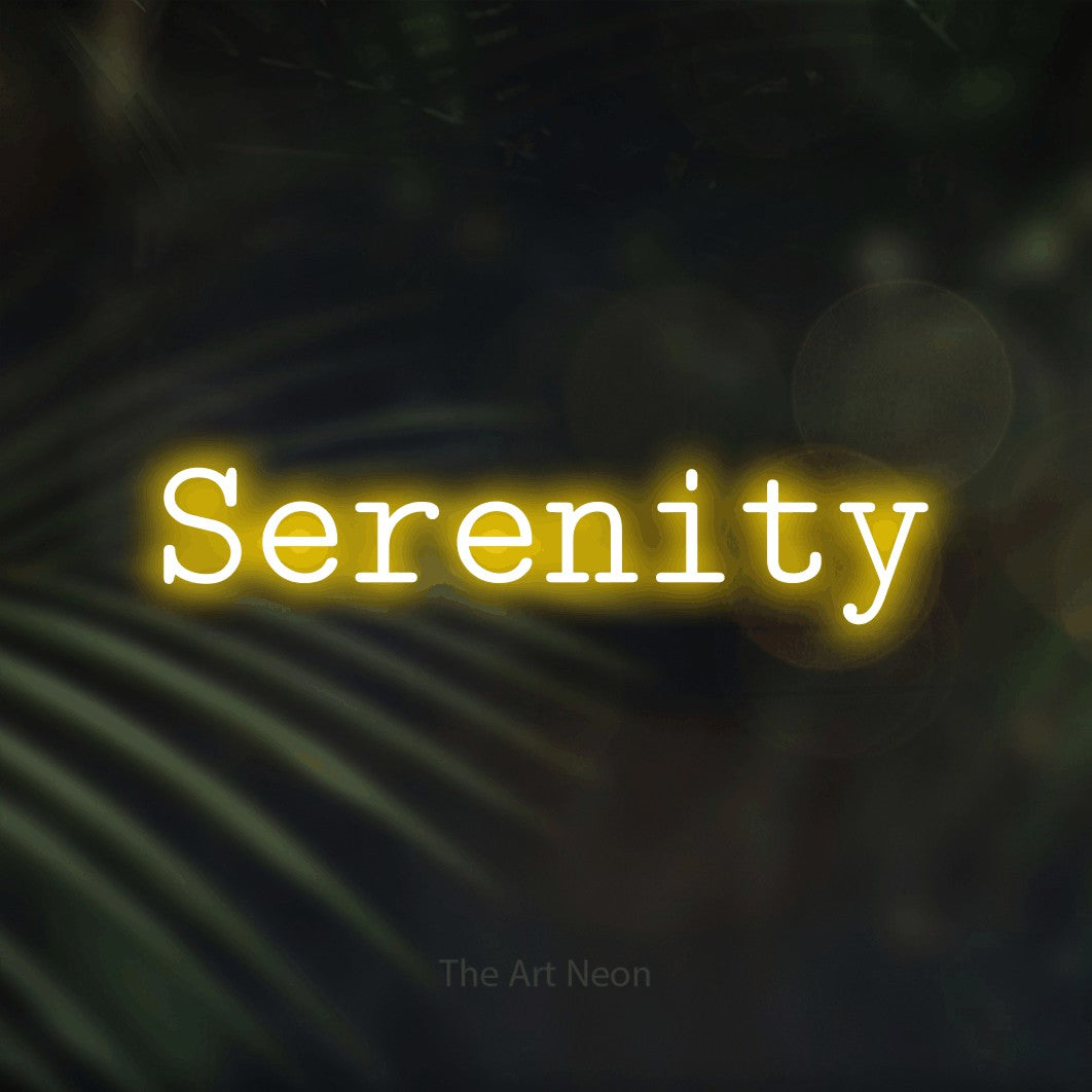 Yellow LED neon sign reading "Serenity" against dark blurred palm leaves for bedroom décor