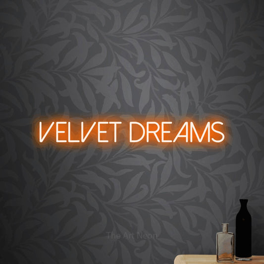 Orange LED neon sign reading "Velvet Dreams" against light grey floral wallpaper for bedroom décor