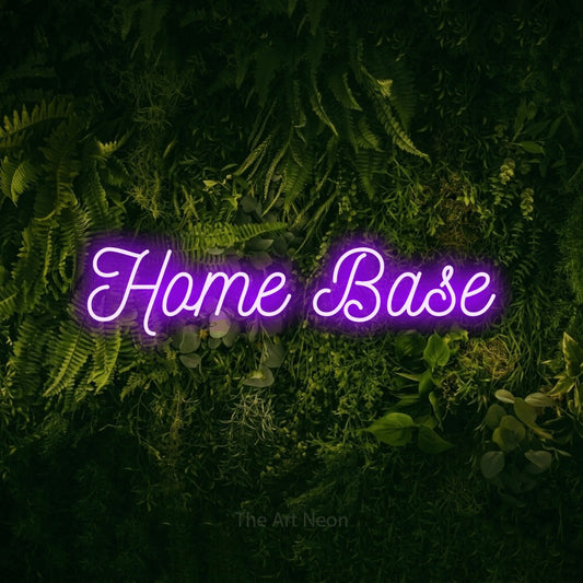 Purple script-style LED neon sign reading "Home Base" against a moss-covered green wall for living room décor