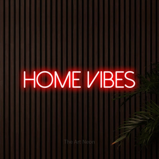 Red LED neon sign reading "Home Vibes" against dark wooden slats for living room décor