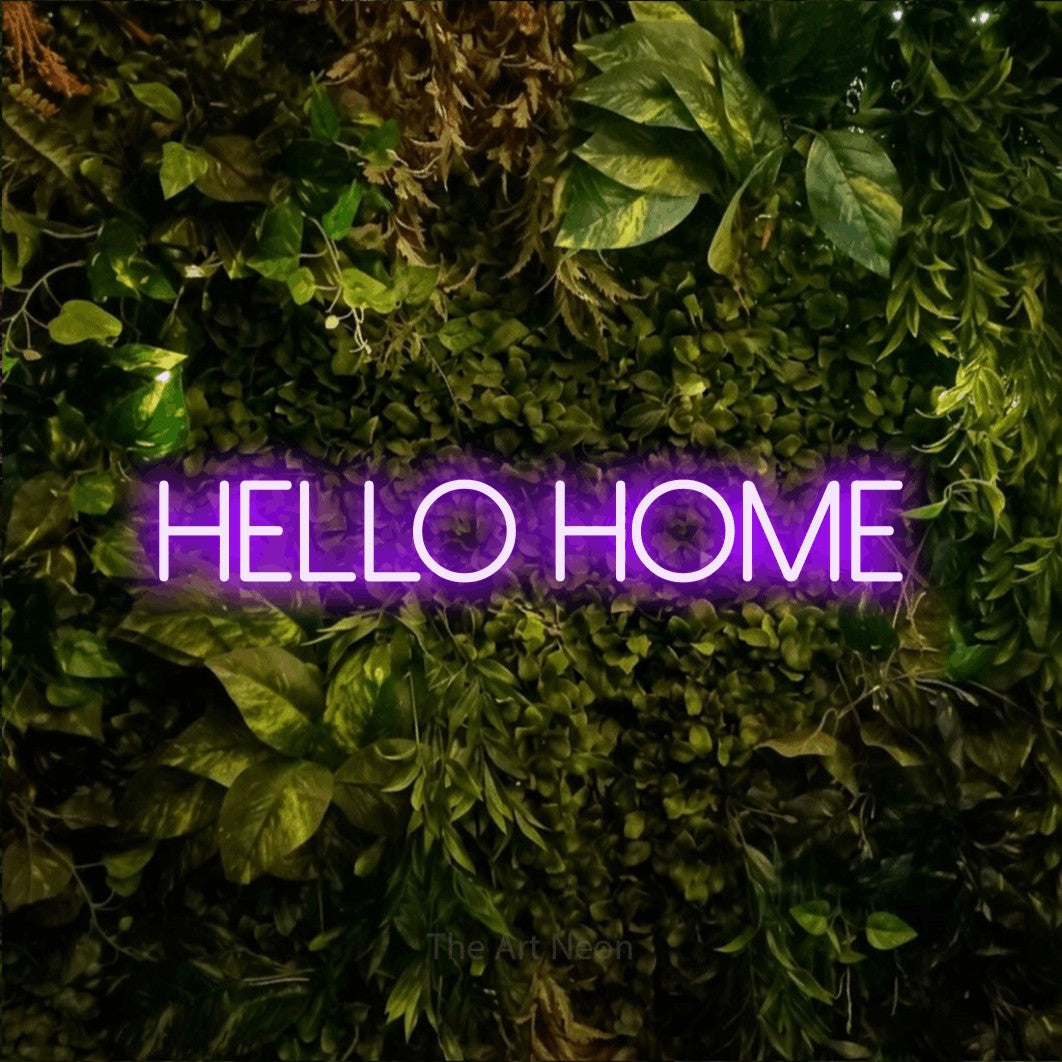 Purple LED neon sign reading "Hello Home" against a textured moss and foliage wall for living room décor