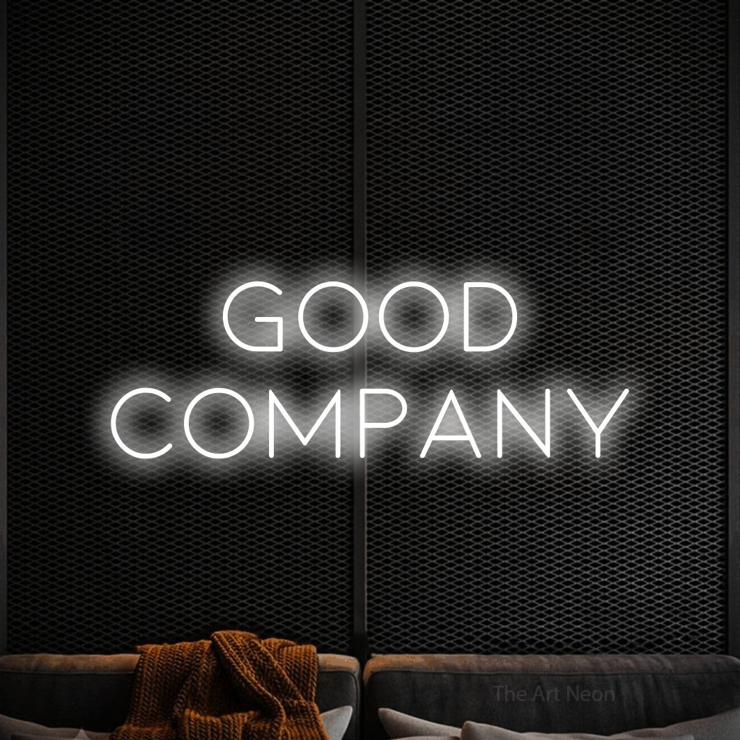 Cool white LED neon sign reading "Good Company" against a black textured wall for living room décor