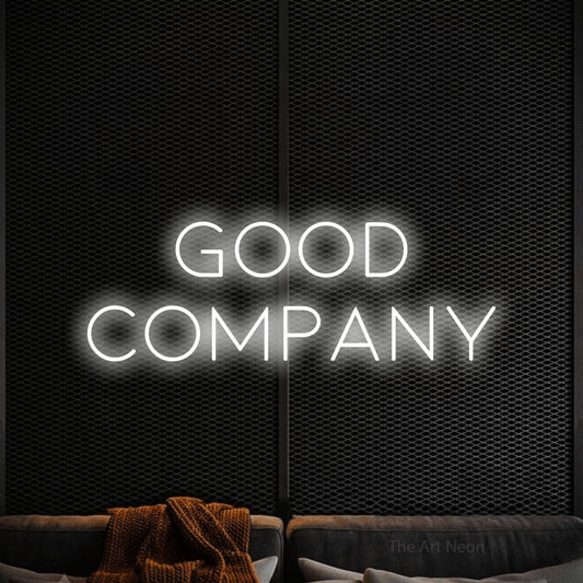 Cool white LED neon sign reading "Good Company" against a black textured wall for living room décor