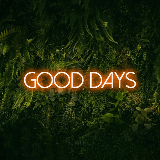 Enseigne néon à DEL à lumière orange, affichant « Good Days » sur un mur vert couvert de mousse, pour décorer un salon