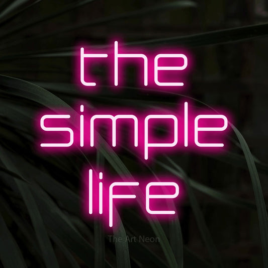 Enseigne néon à DEL à lumière rose vif, affichant « The Simple Life » sur des feuilles tropicales foncées, pour décorer un salon
